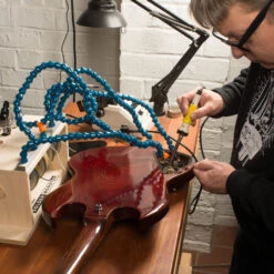 StewMac Solder Monster - StewMac -Fine Musical Instruments 0531 3 monster in use 3000px