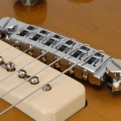 Pigtail Aluminum Wraparound Bridge - StewMac 8 Pigtail Aluminum Wraparound Bridge - StewMac -Fine Musical Instruments 4507 3 in use 1600px