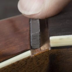 Angled Nut Seating File For Martin - StewMac -Fine Musical Instruments 5074 3 angled20file20in20use201203000jpg